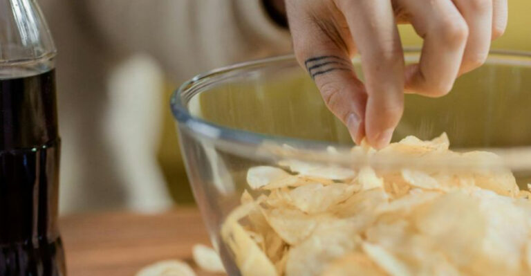 snacking chips and drinking coke