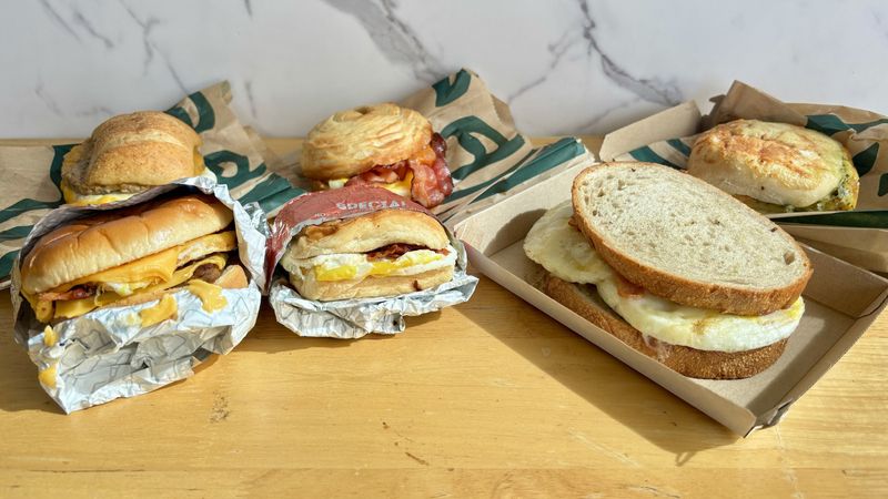 Eating Fast-Food Breakfast Sandwiches